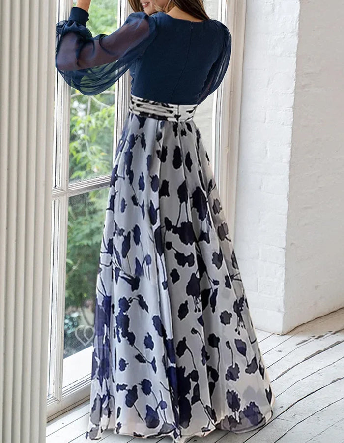 Robe longue élégante en mousseline de soie bleu marine avec jupe à imprimé floral et manches bouffantes transparentes