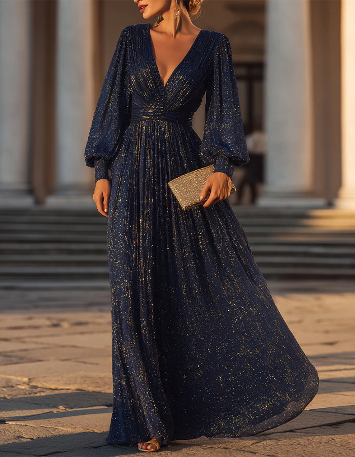 Vestido largo azul marino y dorado con mangas abullonadas
