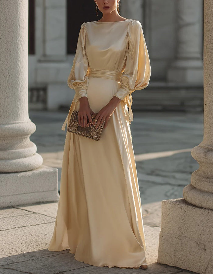 Vestido largo de satén color champán con mangas abullonadas
