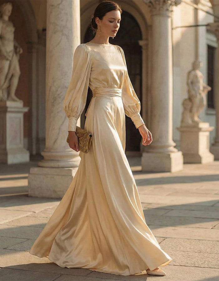 Vestido largo de satén color champán con mangas abullonadas