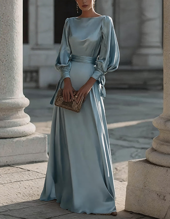 Vestido largo de satén color champán con mangas abullonadas