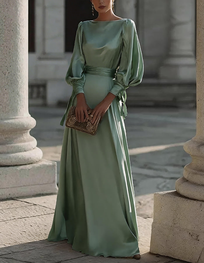 Vestido largo de satén color champán con mangas abullonadas