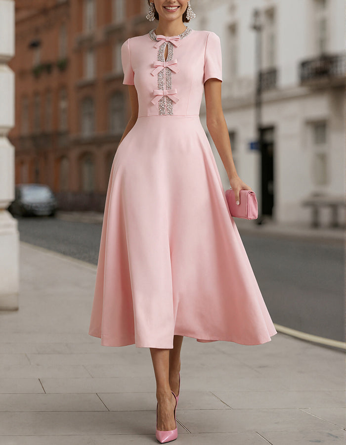 Pink Satin With Rhinestone Bow Cinching The Waist Midi Dress