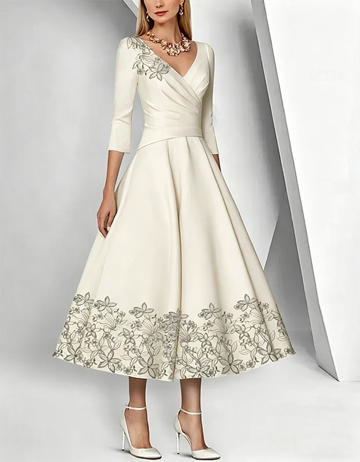 Graceful Satin Tea-Length Dress with Embroidered Floral Accents and 3/4 Sleeves