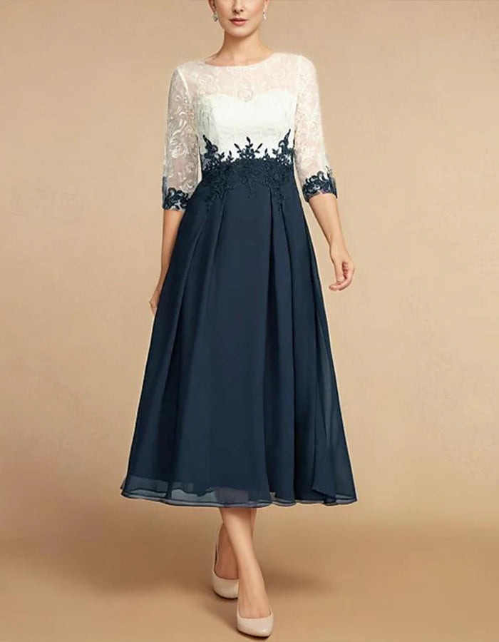 Vestido midi con cuello redondo y encaje.