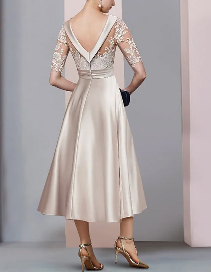 Vestido midi de encaje color blanco roto con cuello redondo