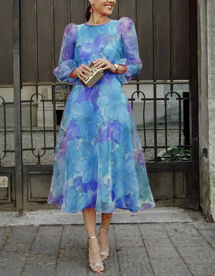 Elegante vestido midi de organza con mangas abullonadas transparentes y estampado floral