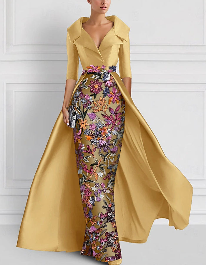 Vestido largo con flores bordadas en la solapa