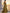 Robe longue en satin doré à épaules dénudées et manches longues
