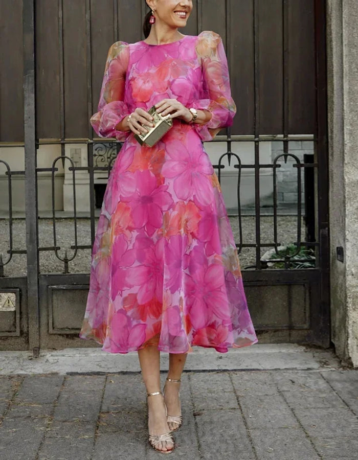 Elegante vestido midi de organza con mangas abullonadas transparentes y estampado floral