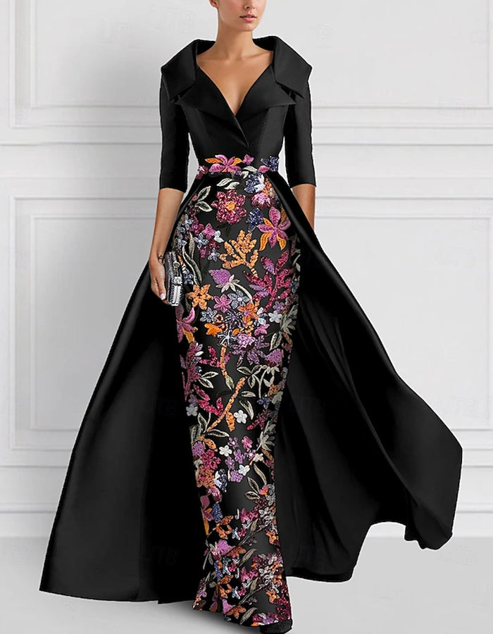 Vestido largo con flores bordadas en la solapa
